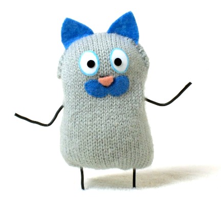 Momo, a grey knitted cat character